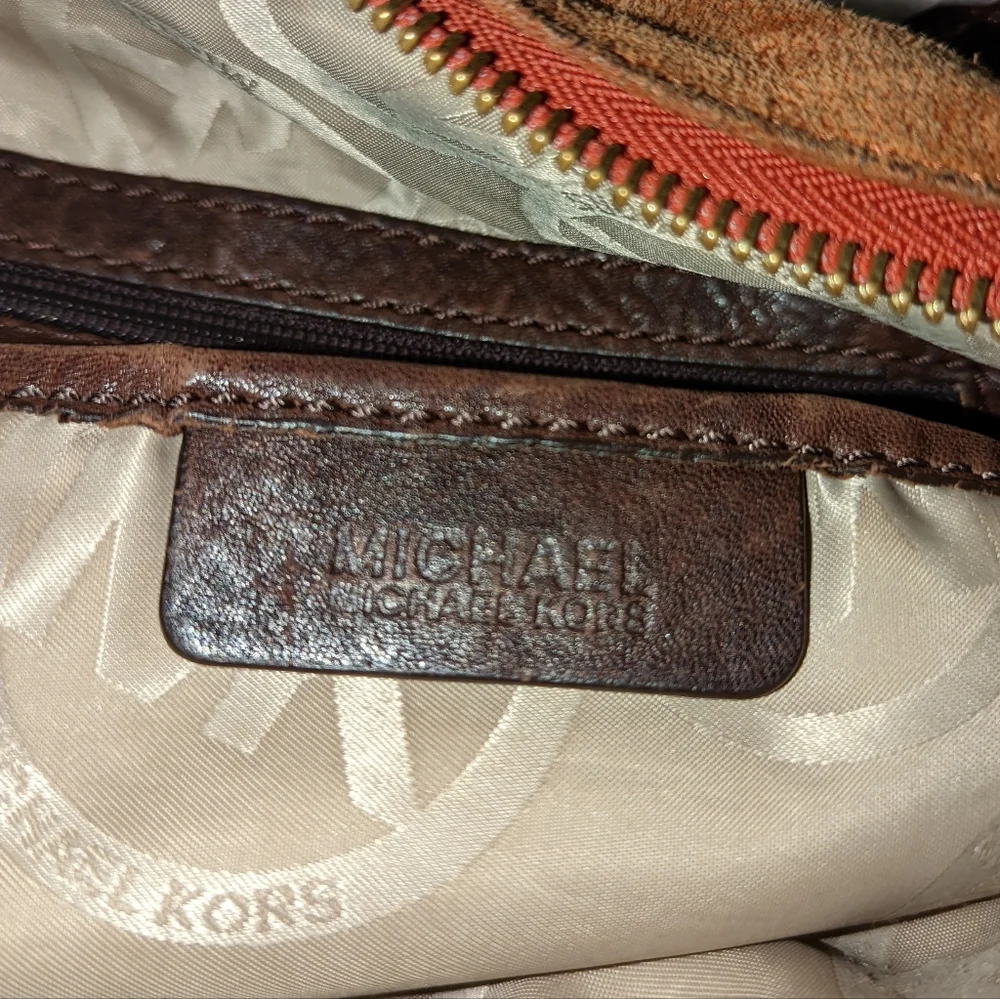 Michael Kors orange suede studded slouchy shoulder bag.